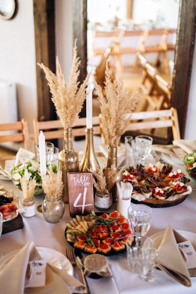 Beautiful wedding table decoration and decor in boho or rustic s